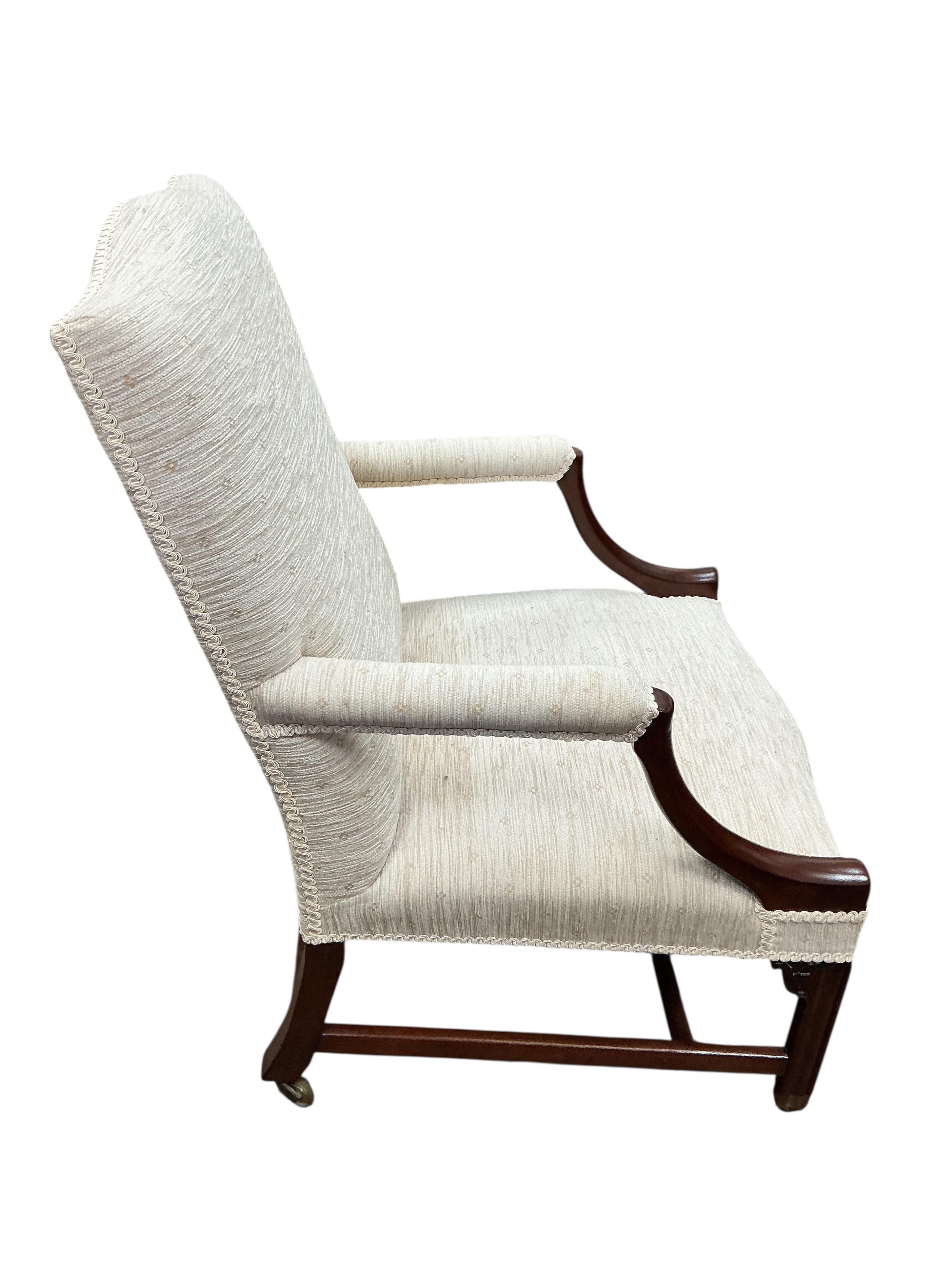 A George III and later Gainsborough type mahogany armchair, width 62cm, depth 65cm, height 96cm